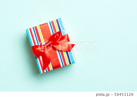 Gift box with red bow for Christmas or New Year Gift box with red bow for Christmas or New Year 58451126