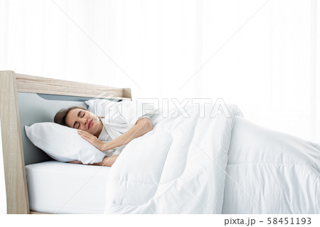 Young beautiful sleep in the bed at home. 58451193