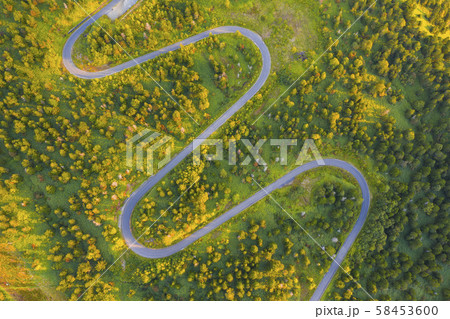 Aerial view of winding road on mountain in Autumn 58453600