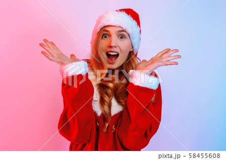 An image of a shocked excited young lady, wearing An image of a shocked excited young lady, wearing 58455608