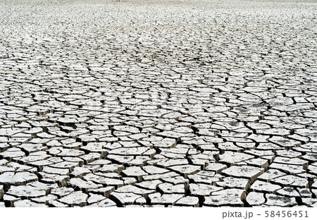 Global warming. Cracked clay without water. 58456451