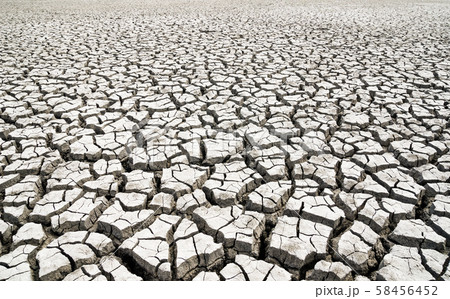 Global warming. Cracked clay without water. 58456452