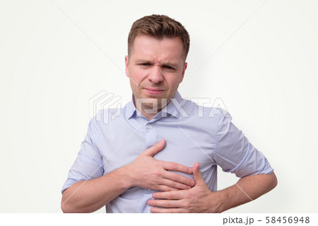 man feeling having heart attack symptom or breast cancer. man feeling having heart attack symptom or breast cancer. 58456948