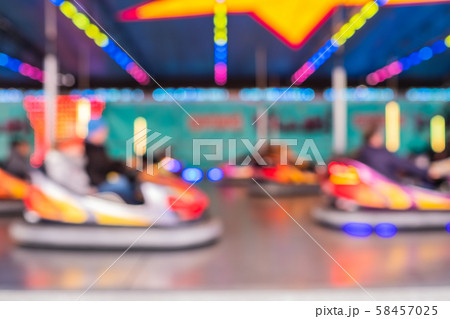 Blurred photo as background of bumper cars at an amusement park 58457025