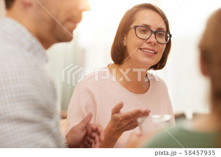 Woman talking to her family 58457935
