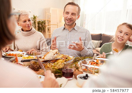 Man have dinner with his family 58457977