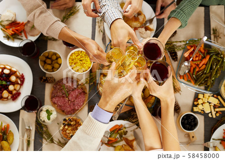 People toasting at the table 58458000