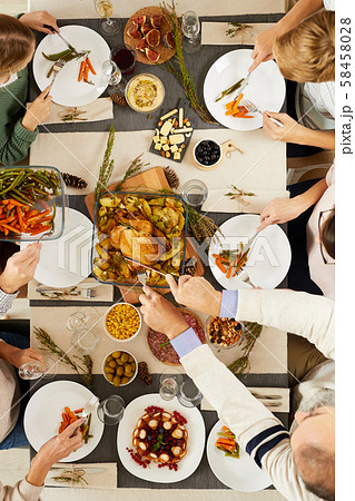 Family eating roast turkey 58458028