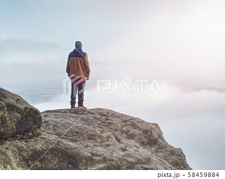 End of misty road in mountains. Boy stay suddenly End of misty road in mountains. Boy stay suddenly 58459884