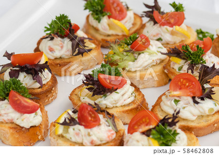 Closeup of delicious canape served on white plate Closeup of delicious canape served on white plate 58462808