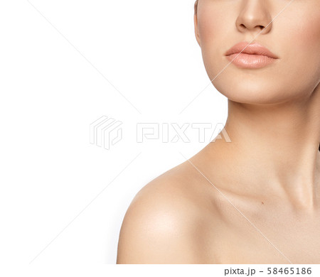 Closeup of plump lips of young woman on white background 58465186
