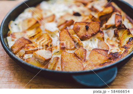 Potatoes baked with meat in the oven. Delicious dinner recipe. Potato pudding. Baked potato. Beef 58466654
