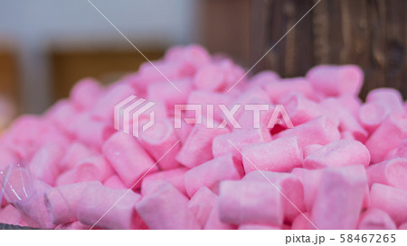 Colorful delicious marshmallow candies for sale on counter of shop 58467265