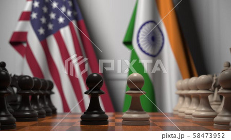 Chess game against flags of USA and India. Political competition related 3D rendering 58473952