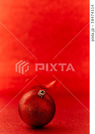Red christmas ball on shiny blur background Red christmas ball on shiny blur background 58474314