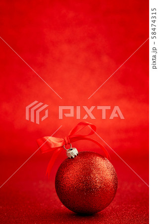 Red christmas ball on shiny blur background Red christmas ball on shiny blur background 58474315