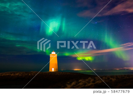 Lighthouse on Reykjanes peninsula under nortern lights. Iceland Lighthouse on Reykjanes peninsula under nortern lights. Iceland 58477679