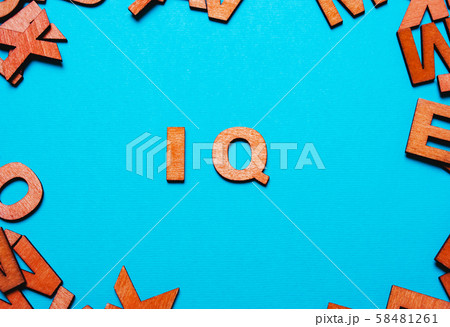 IQ of wooden letters on a blue background IQ of wooden letters on a blue background 58481261