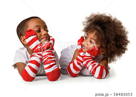 preschool aged siblings looking to each others 58483053