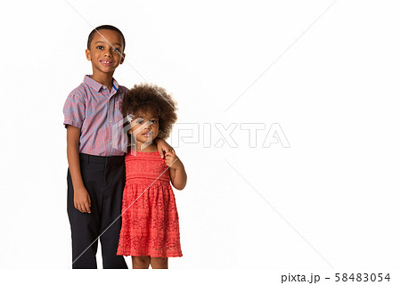 two cheerful african-american siblings, isolated 58483054