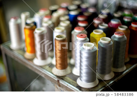 Many roll of bobbin thread colourful Many roll of bobbin thread colourful 58483386