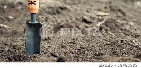 Garden trowel on the ground against the soil. Background in blur. 58483585