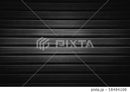 Metal grill with a rubber textured coating in black.Background. Metal grill with a rubber textured coating in black.Background. 58484106