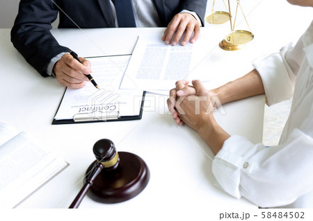 Judge or lawyer talking with team or client Judge or lawyer talking with team or client 58484502