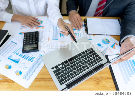 Businessman coaching office staff Businessman coaching office staff 58484503