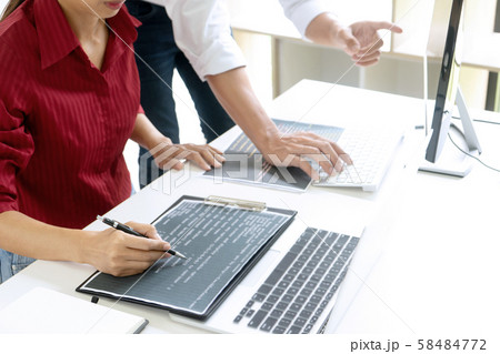 Teamwork team programmer working with computer Teamwork team programmer working with computer 58484772