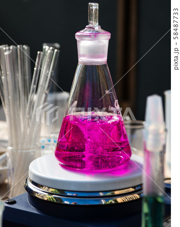 Test tubes with a colored reagents in a rack 58487733