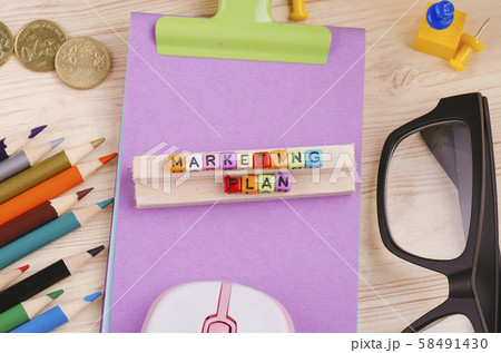 cube with word MARKETING PLAN on wooden desk cube with word MARKETING PLAN on wooden desk 58491430