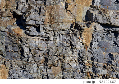 Rocks carved by sea water erosion. Stones texture and background. Rock texture Rocks carved by sea water erosion. Stones texture and background. Rock texture 58492667
