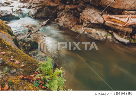 Mountain river stream closeup, large rocky rocks. 58494396