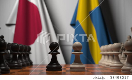 Chess game against flags of Japan and Sweden. Political competition related 3D rendering 58498017