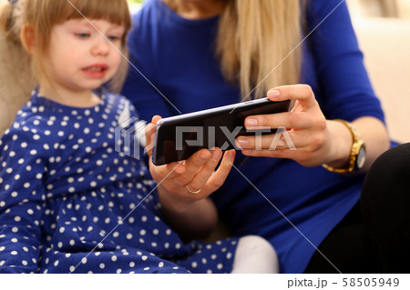 Cute little girl on floor carpet with mom Cute little girl on floor carpet with mom 58505949