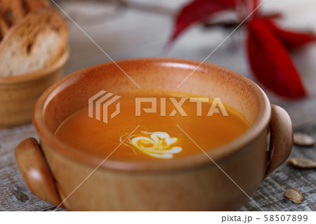 Pumpkin cream soup in a ceramic dish Pumpkin cream soup in a ceramic dish 58507899