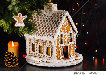 Gingerbread house on a dark background Gingerbread house on a dark background 58507900