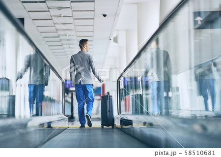 Well dressed man travel by airplane 58510681