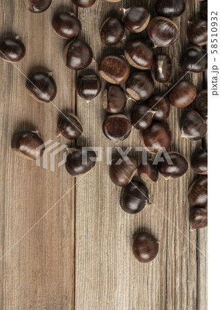 ripe and fresh chestnuts on wooden table with copy 58510932
