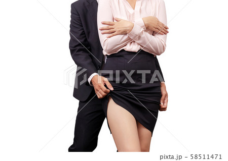 sexual assault and abuse against women at work concept. male manager molesting female employee by touch leg under skirt in workplace sexual assault and abuse against women at work concept. male manager molesting female employee by touch leg under skirt in workplace 58511471