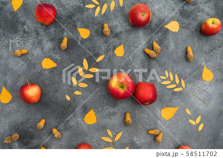 Autumn composition. Fall leaves, apple and acorns on dark background. Thanksgiving day concept 58511702