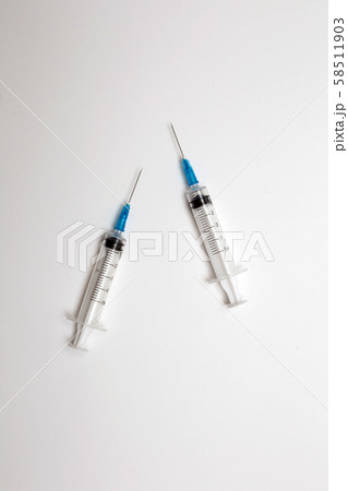 Medical syringe isolated over white background, injection needles for medical use, 58511903