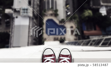 depression man stand on the edge of high building looking down at the ground and contemplating to commit suicide by jump buildings. commit suicide and major depressive disorder concept 58513487