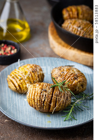 Baked hasselback potatoes 58513883