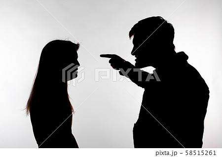 Aggression and abuse concept - man and woman expressing domestic violence in studio silhouette Aggression and abuse concept - man and woman expressing domestic violence in studio silhouette 58515261