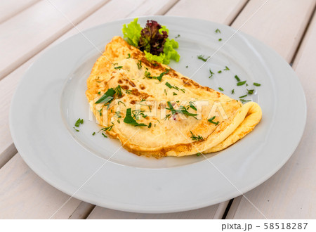 An Omelet with lettuce and a herbs 58518287