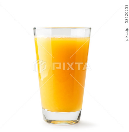 Orange juice in a glass close-up on a white 58520255