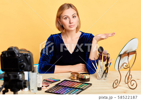 Popular lifestyle blogger girl recording beauty master class at home studio Popular lifestyle blogger girl recording beauty master class at home studio 58522187