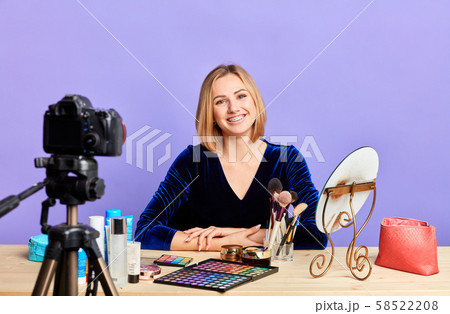 Attractive young female beauty blogger recording new content for video blog 58522208